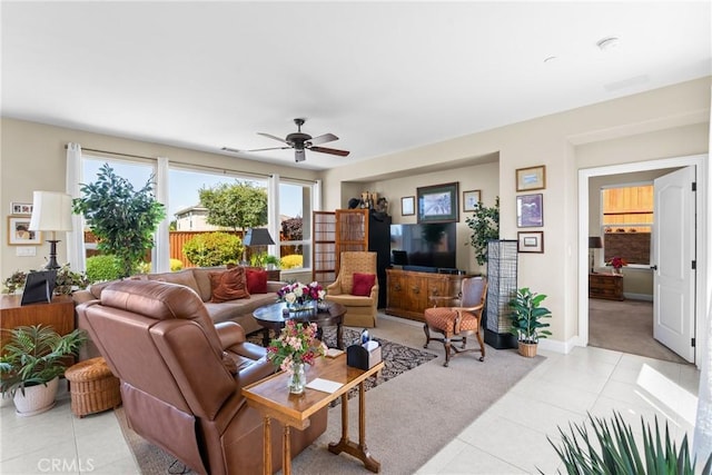 905 Romneya Ln, Santa Maria, CA 93455 - living area featuring light tile patterned floors, a ceiling fan, baseboards, and light carpet