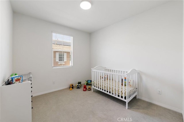 16502 Casa Grande Ave Unit 109, Fontana, CA 92336 - bedroom featuring carpet floors, a nursery area, and baseboards
