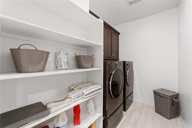 16502 Casa Grande Ave Unit 109, Fontana, CA 92336 - washroom with cabinet space, washing machine and dryer, and baseboards