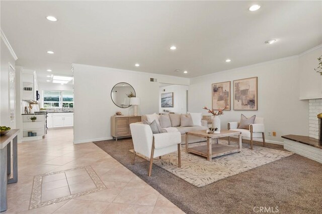 1525 E Baldwin Ave, Orange, CA 92865 - living area featuring ornamental molding, recessed lighting, a brick fireplace, baseboards, and light tile patterned floors