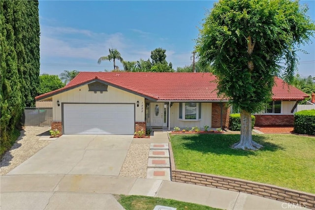 1525 E Baldwin Ave, Orange, CA 92865 - ranch-style house with brick siding, a tile roof, an attached garage, concrete driveway, and board and batten siding