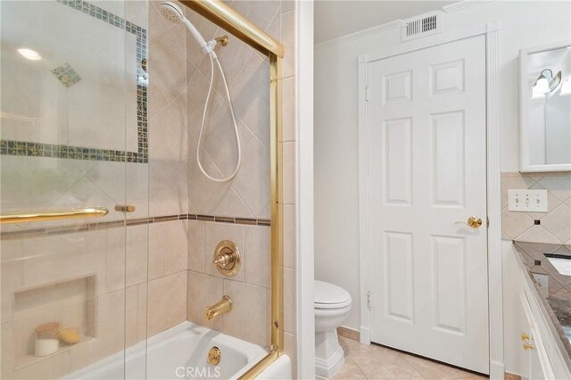 1525 E Baldwin Ave, Orange, CA 92865 - bathroom featuring toilet, bath / shower combo with glass door, and ornamental molding