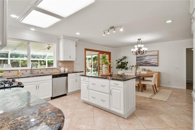1525 E Baldwin Ave, Orange, CA 92865 - kitchen featuring stainless steel dishwasher, ornamental molding, a sink, a chandelier, and light tile patterned floors