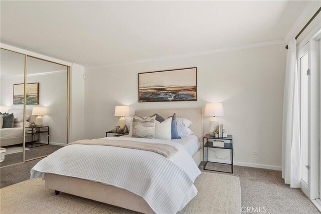 1525 E Baldwin Ave, Orange, CA 92865 - bedroom featuring carpet, baseboards, crown molding, and a closet