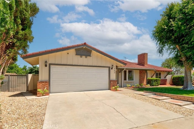 1525 E Baldwin Ave, Orange, CA 92865 - ranch-style home featuring a chimney, an attached garage, concrete driveway, and brick siding