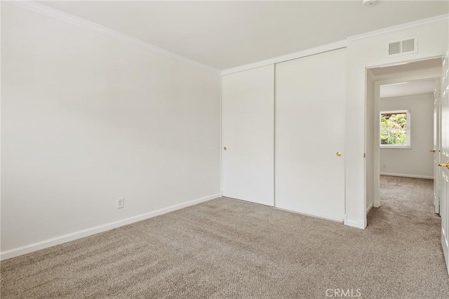 1525 E Baldwin Ave, Orange, CA 92865 - unfurnished bedroom with carpet flooring, baseboards, ornamental molding, and a closet