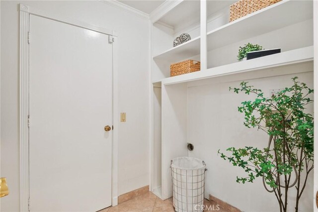 1525 E Baldwin Ave, Orange, CA 92865 - laundry room with crown molding and light tile patterned flooring