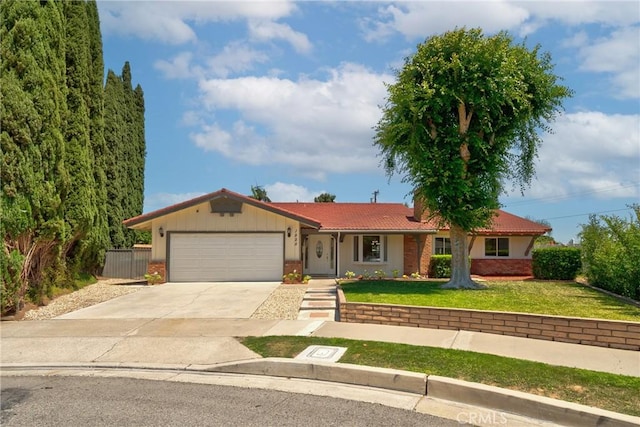 1525 E Baldwin Ave, Orange, CA 92865 - single story home with an attached garage, concrete driveway, and brick siding