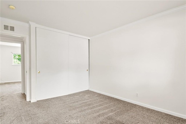1525 E Baldwin Ave, Orange, CA 92865 - unfurnished bedroom with carpet flooring, crown molding, baseboards, and a closet