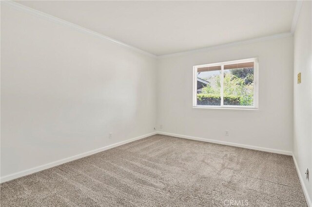 1525 E Baldwin Ave, Orange, CA 92865 - carpeted empty room with crown molding and baseboards