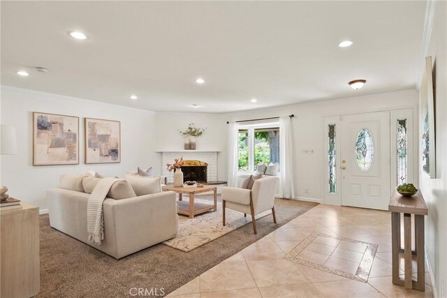 1525 E Baldwin Ave, Orange, CA 92865 - living room featuring recessed lighting, crown molding, a brick fireplace, baseboards, and inlaid floor details