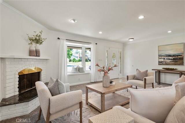1525 E Baldwin Ave, Orange, CA 92865 - living area featuring crown molding, a brick fireplace, recessed lighting, and baseboards