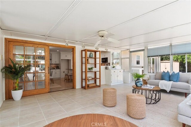 1525 E Baldwin Ave, Orange, CA 92865 - living area featuring track lighting, light tile patterned flooring, and a ceiling fan