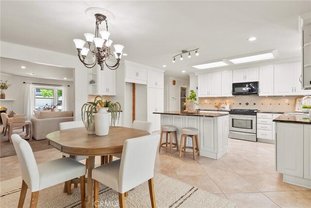 1525 E Baldwin Ave, Orange, CA 92865 - dining room with light tile patterned floors, a chandelier, recessed lighting, and ornamental molding