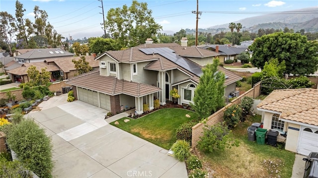 823 Sonora Ct, San Dimas, CA 91773 - view of front of house with driveway, a chimney, a mountain view, a residential view, and a garage