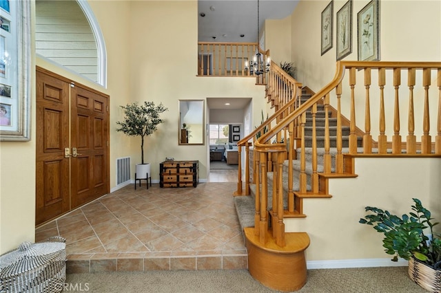 823 Sonora Ct, San Dimas, CA 91773 - foyer entrance with a high ceiling, stairs, baseboards, and a chandelier