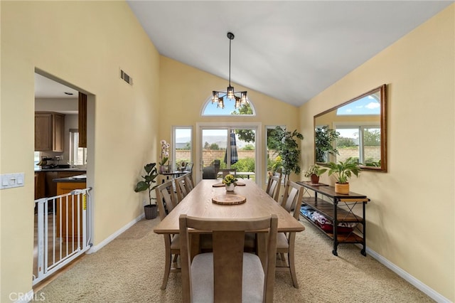 823 Sonora Ct, San Dimas, CA 91773 - dining space with light colored carpet, high vaulted ceiling, a chandelier, and baseboards