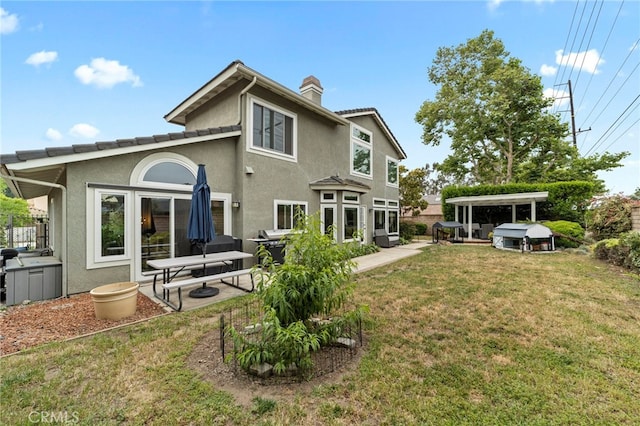 823 Sonora Ct, San Dimas, CA 91773 - rear view of property with a chimney, a lawn, stucco siding, and a patio area