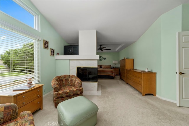 823 Sonora Ct, San Dimas, CA 91773 - living area with light colored carpet, a ceiling fan, a fireplace, lofted ceiling, and baseboards