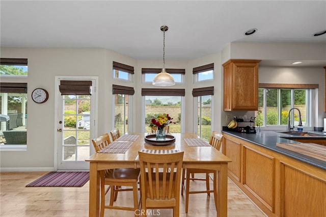 823 Sonora Ct, San Dimas, CA 91773 - dining area with healthy amount of natural light, light wood-style flooring, and baseboards