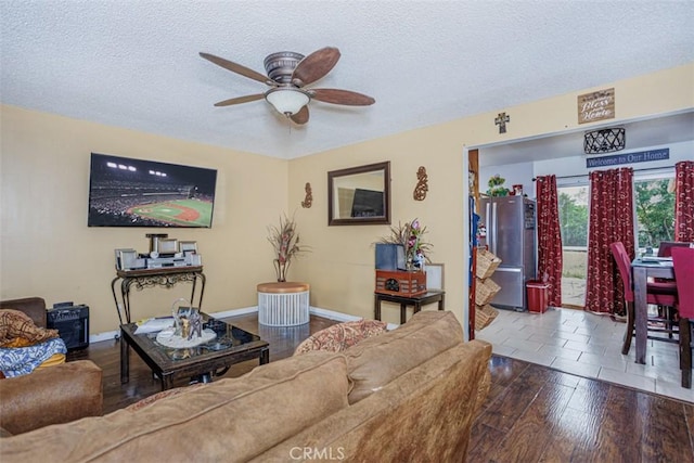 1089 Jadestone Ln, Corona, CA 92882 - living area with a ceiling fan, a textured ceiling, baseboards, and wood finished floors