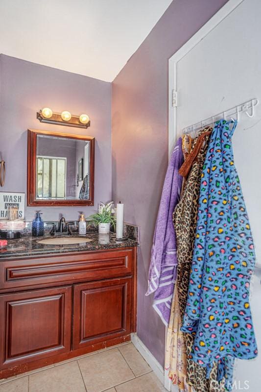 1089 Jadestone Ln, Corona, CA 92882 - bathroom featuring vanity, tile patterned flooring, and baseboards