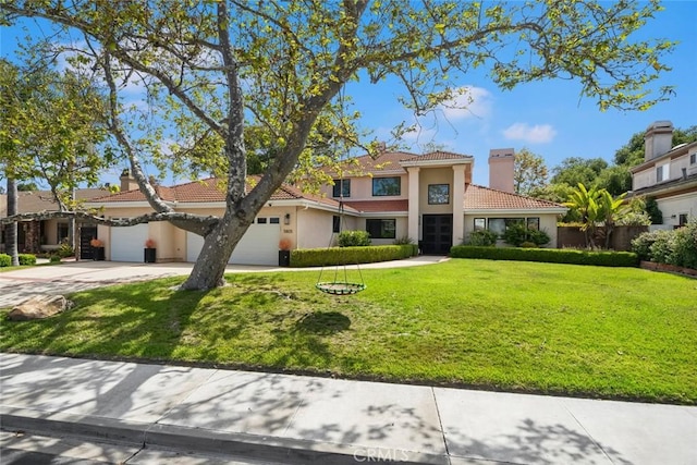 5805 Salisbury Ln, San Luis Obispo, CA 93401 - mediterranean / spanish-style house with a chimney, driveway, a tile roof, stucco siding, and a front lawn