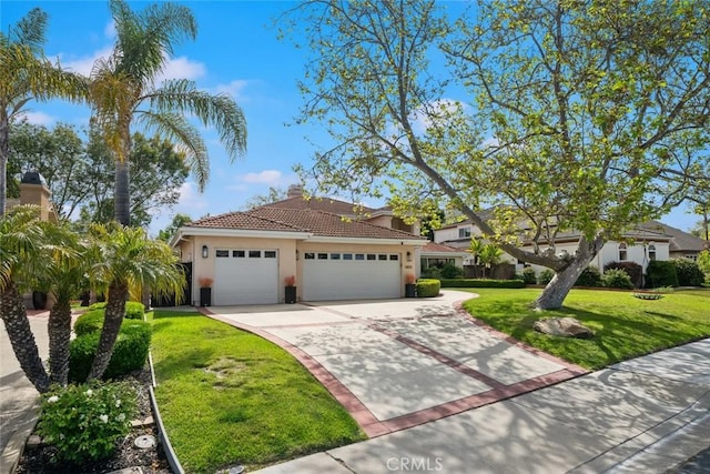 5805 Salisbury Ln, San Luis Obispo, CA 93401 - view of front of property featuring concrete driveway, a garage, stucco siding, a front yard, and a tiled roof