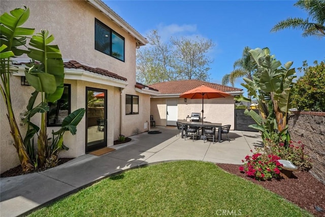 5805 Salisbury Ln, San Luis Obispo, CA 93401 - back of house featuring stucco siding, a tiled roof, and a patio area