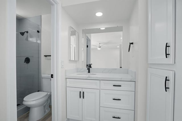2286 Levante St, Carlsbad, CA 92009 - full bathroom featuring vanity, toilet, ceiling fan, a shower stall, and recessed lighting