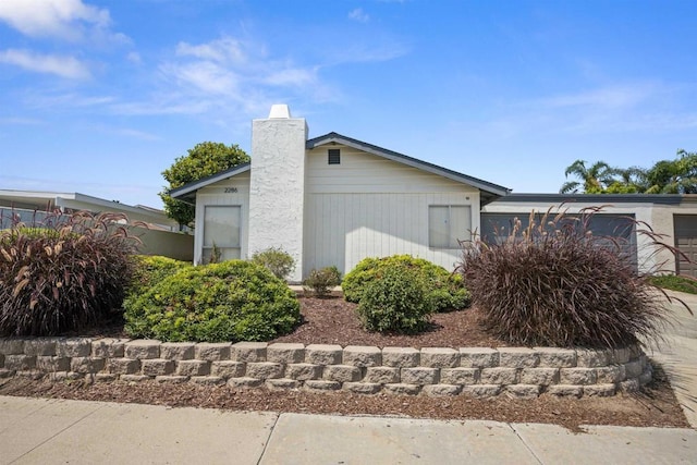 2286 Levante St, Carlsbad, CA 92009 - view of property exterior with a chimney