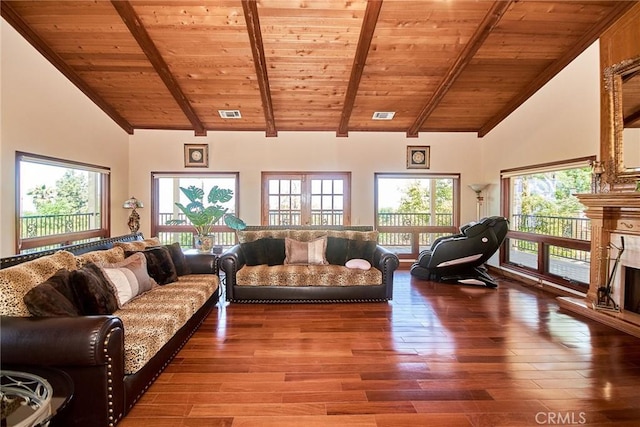 2036 S Buenos Aires Dr, Covina, CA 91724 - living area featuring wooden ceiling with exposed beams, wood finished floors, high vaulted ceiling, and a fireplace with raised hearth