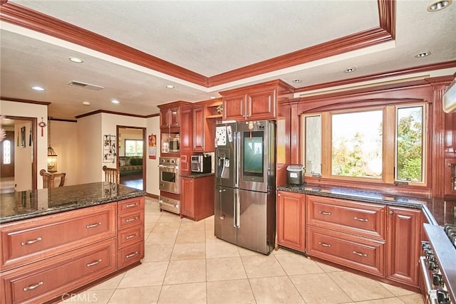 2036 S Buenos Aires Dr, Covina, CA 91724 - kitchen with appliances with stainless steel finishes, crown molding, dark stone countertops, a textured ceiling, and light tile patterned floors