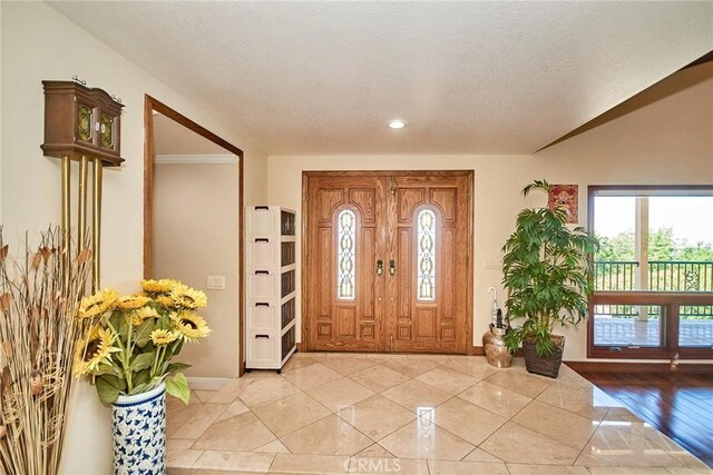 2036 S Buenos Aires Dr, Covina, CA 91724 - foyer featuring baseboards, recessed lighting, a textured ceiling, and light tile patterned floors