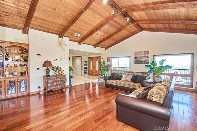 2036 S Buenos Aires Dr, Covina, CA 91724 - living room with rail lighting, wooden ceiling with exposed beams, light wood-type flooring, high vaulted ceiling, and baseboards