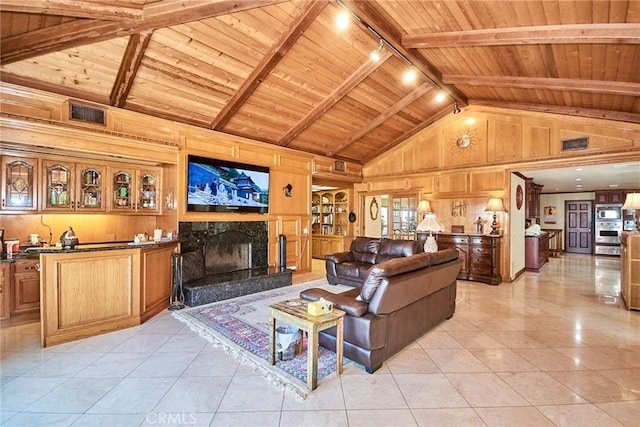 2036 S Buenos Aires Dr, Covina, CA 91724 - living room featuring wooden ceiling with exposed beams, high vaulted ceiling, light tile patterned flooring, wood walls, and a fireplace