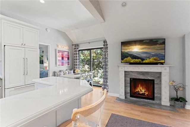 27625 High Knoll Rd, Lake Arrowhead, CA 92352 - living area featuring light wood finished floors, a premium fireplace, vaulted ceiling, baseboards, and recessed lighting