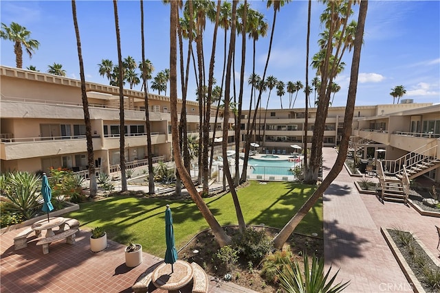 277 E Alejo Rd Unit 212, Palm Springs, CA 92262 - surrounding community featuring a lawn