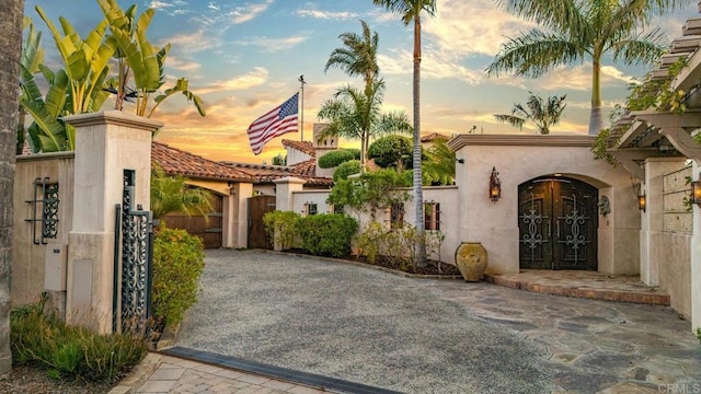 4652 Resmar Rd, La Mesa, CA 91941 - view of front of property with a gate, stucco siding, and a tiled roof