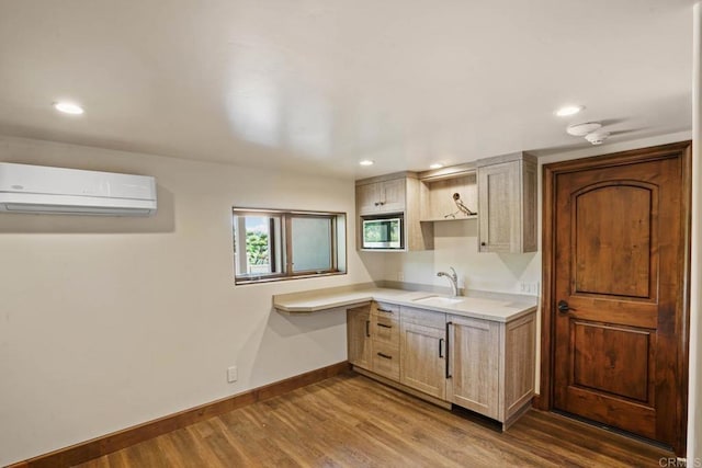 4652 Resmar Rd, La Mesa, CA 91941 - kitchen with a wall mounted AC, baseboards, dark wood-type flooring, a sink, and light countertops
