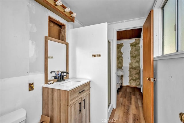 11970 N Dr, Clearlake, CA 95422 - bathroom featuring toilet, vanity, a shower with door, and wood finished floors