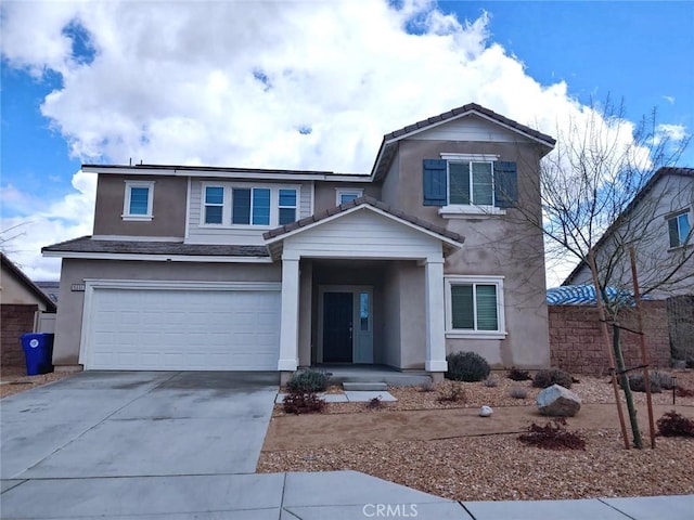 15555 San Diego Ln, Victorville, CA 92394 - traditional-style house with driveway, a garage, and stucco siding