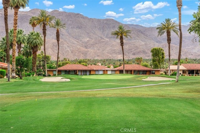 28 Malaga Dr, Rancho Mirage, CA 92270 - surrounding community with a mountain view, view of golf course, a yard, and a putting green