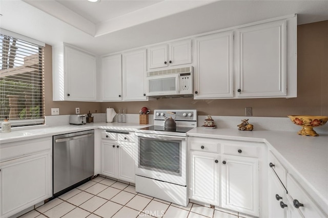 28 Malaga Dr, Rancho Mirage, CA 92270 - kitchen with white appliances, white cabinetry, and light countertops