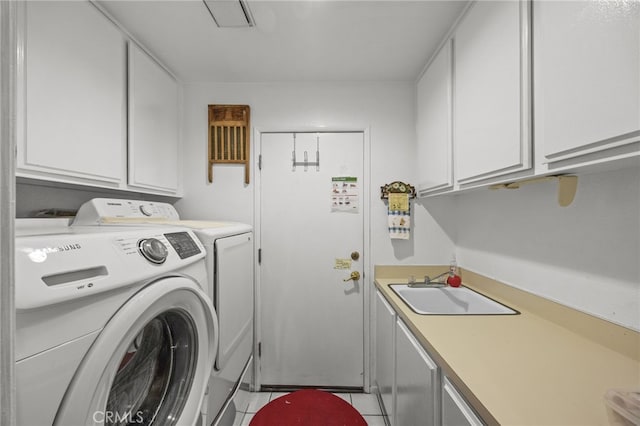 17477 Owl Tree Rd, Riverside, CA 92504 - washroom with independent washer and dryer, cabinet space, and light tile patterned floors