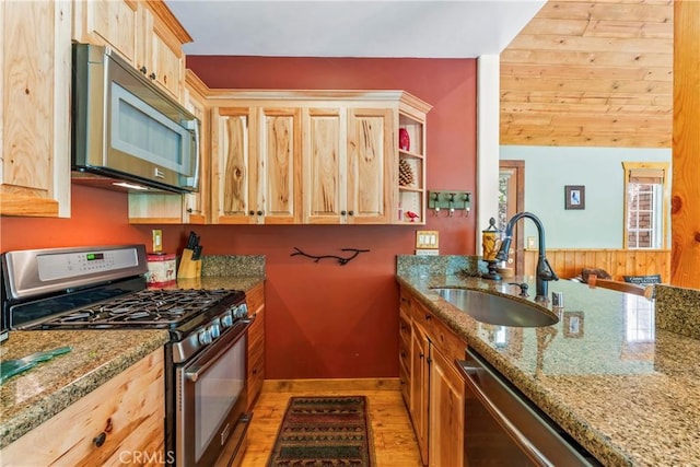 118 E Ln, Lake Arrowhead, CA 92352 - kitchen featuring appliances with stainless steel finishes, light wood-style floors, light stone countertops, and light brown cabinets