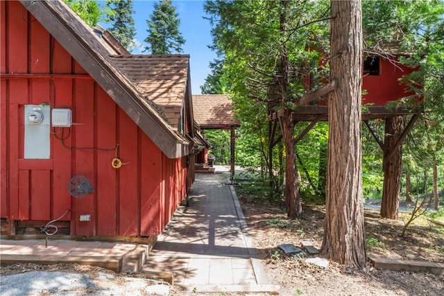 118 E Ln, Lake Arrowhead, CA 92352 - view of home's exterior featuring roof with shingles and board and batten siding