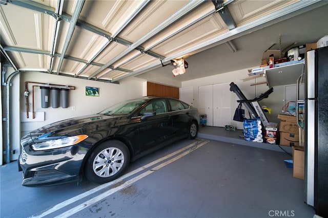 532 Venice Way Unit 8, Inglewood, CA 90302 - garage featuring freestanding refrigerator and a garage door opener