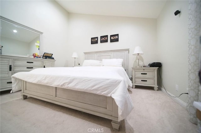 532 Venice Way Unit 8, Inglewood, CA 90302 - bedroom with lofted ceiling, light carpet, and baseboards