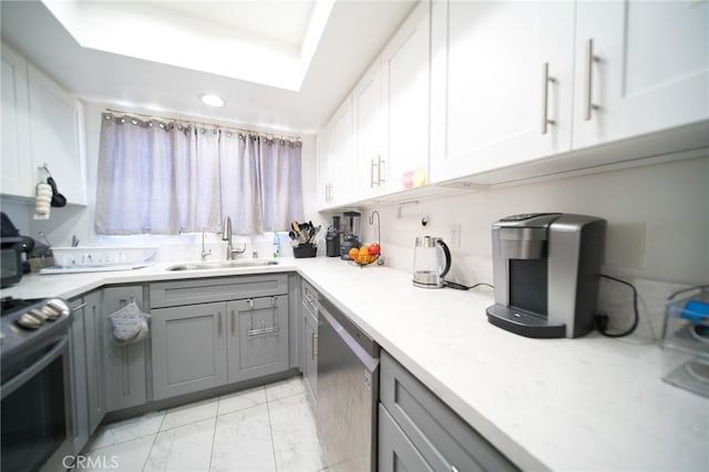 532 Venice Way Unit 8, Inglewood, CA 90302 - kitchen with gray cabinetry, appliances with stainless steel finishes, light marble finish flooring, light countertops, and recessed lighting
